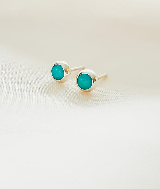 aqua sterling silver stud earrings against white backgroun